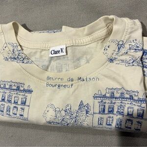 Clare V Cream Tee with blue prints of a house in France.